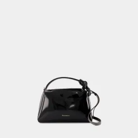 JW ANDERSON The Corner Mini Crossbody in Black Coated Denim