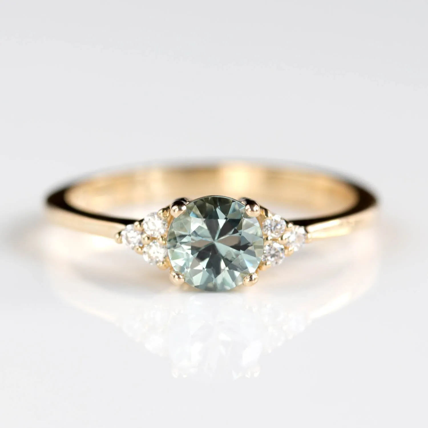 Seven Stone Basket Cluster Engagement Ring with a 5mm Malawi Sapphire